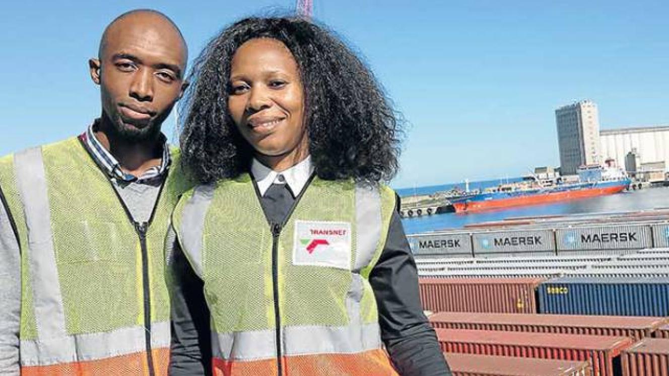 East London terminal manager Wandisa Vazi and her safety, health, environment and quality manager Lwando Mhlauli, with the grain elevator silos on the West Bank of East London’s port in the background. 