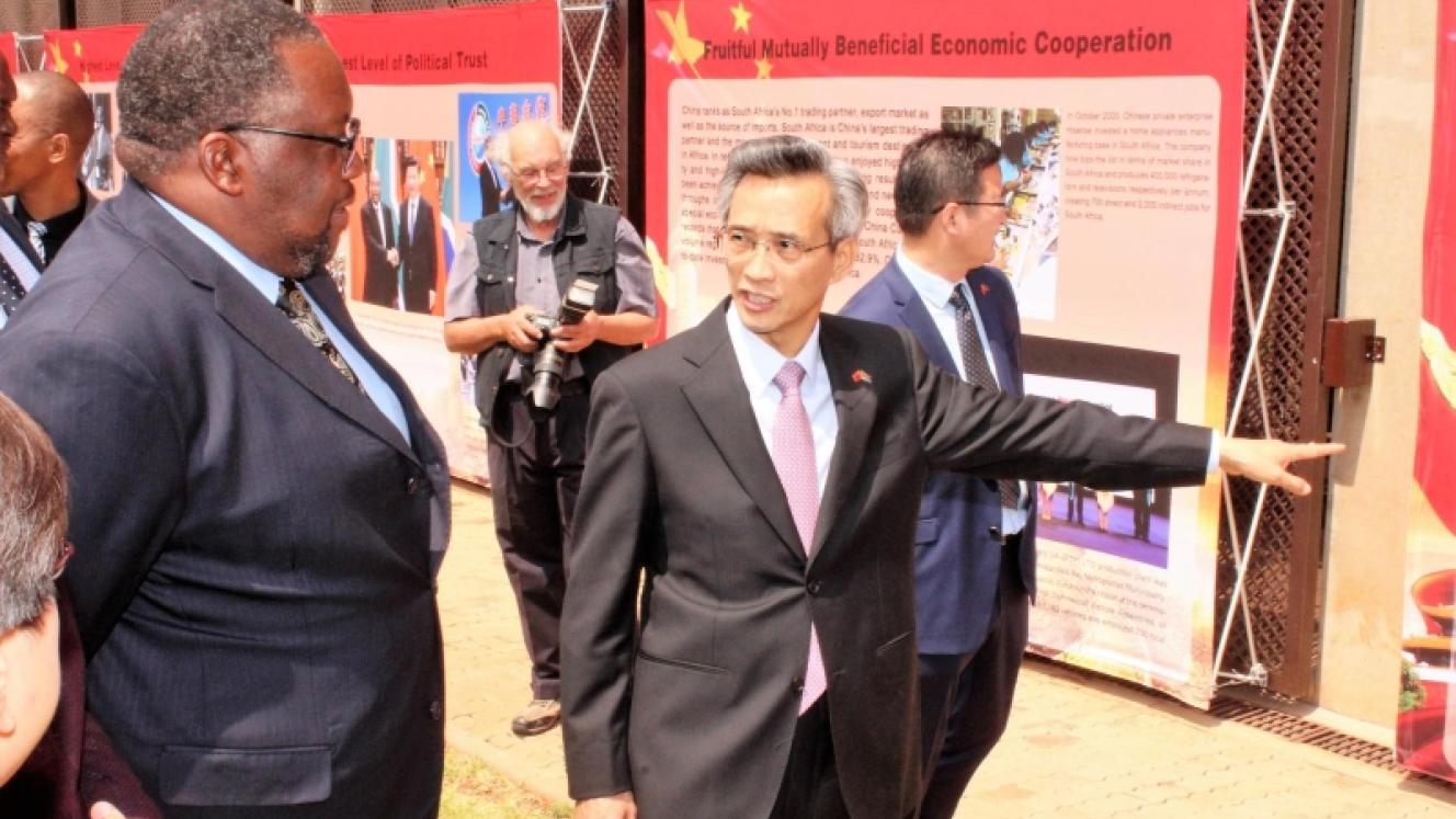Chinese Ambassador to SA, Lin Songhtian (right), showing Minister of Public Works, Nkosinathi Nhleko, some of the displays showcased at the event.