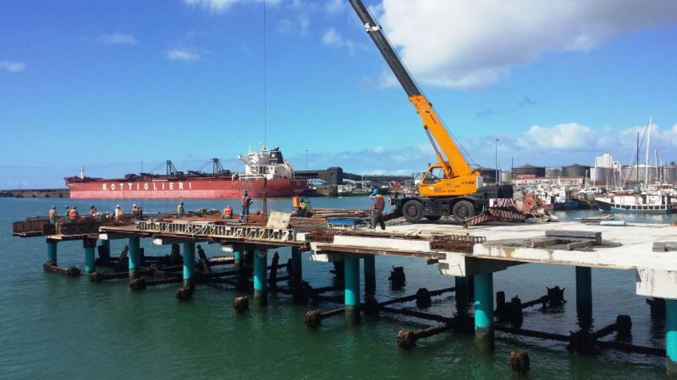 A crane in action during the construction of the lead-in jetties.