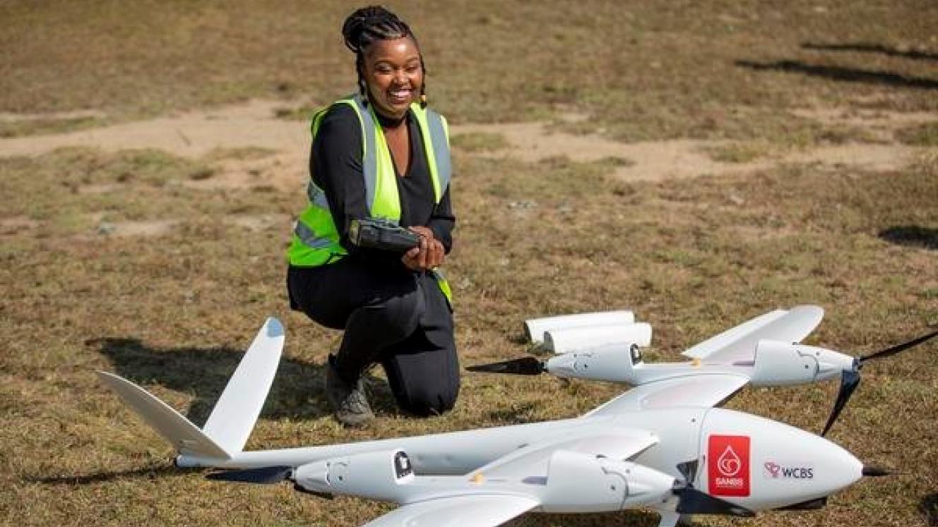 An official shows off the TRON Unmanned Aerial Vehicle (UAV)