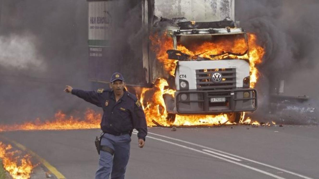 Truck burning in SA appears to be spilling out of control. 