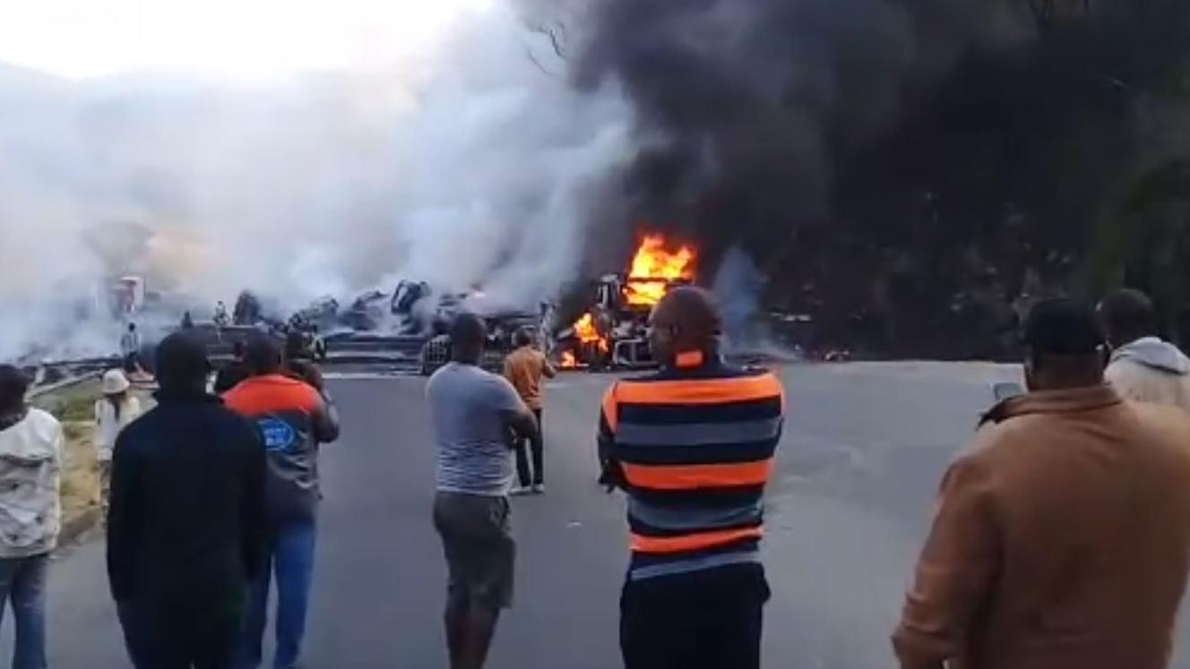 Bystanders witness the inferno that ensued when a truck collided with a jet-fuel carrying tanker north of Chirundu.