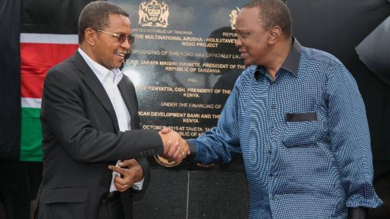 Kenyan president Uhuru Kenyatta (left) and Tanzania’s president Jakaya Kikwete jointly unveiled a commemorative plaque during the official launch of the Arusha-Holili/Taveta-Mwatate road.