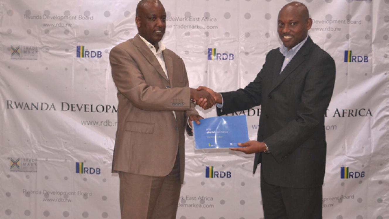 TMEA Rwanda country director, Hannington Namara (right) and RDB CFO, Mark Nkurunziza (left) during the launch of RDB’s One Stop Centre online portal. 