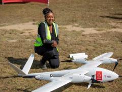 An official shows off the TRON Unmanned Aerial Vehicle (UAV)