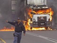 Truck burning in SA appears to be spilling out of control. 