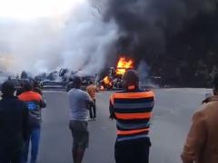 Bystanders witness the inferno that ensued when a truck collided with a jet-fuel carrying tanker north of Chirundu.