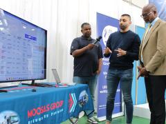  Nazier Veldsman and Muhammed Moosa of Moosa’s Group show Minister Isaac Sileku how they use the RTMS digital toolkit. 