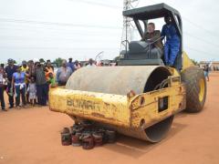 Minister of Trade and Industry, Dr Rob Davies, destroying illegal paraffin stoves confiscated in Tembisa.