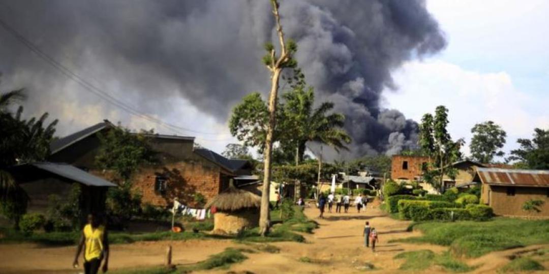 Smoke rises from a UN compound in Beni, attacked by civilians accusing peace keepers for not protecting them against rebels.