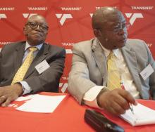 Better days… Transnet board chairman Popo Molefe and outgoing CEO Tau Morwe before the latter learned that his contract would not be extended.
